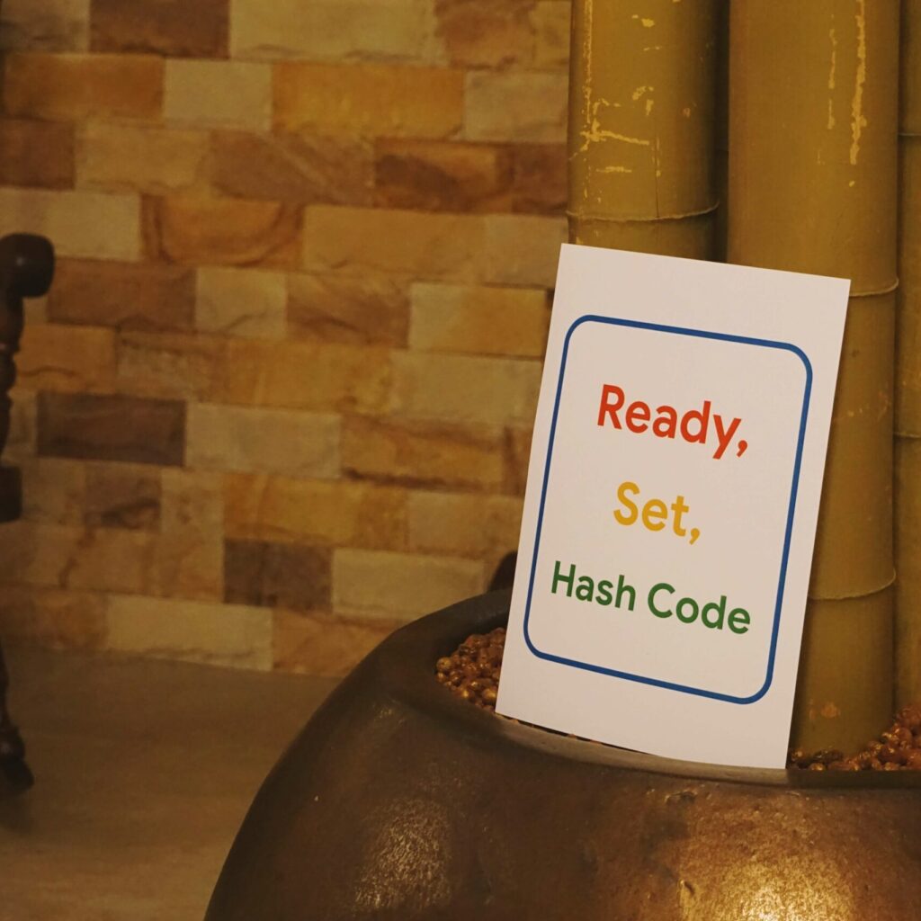 a banner with "ready, set, hash code" text on it